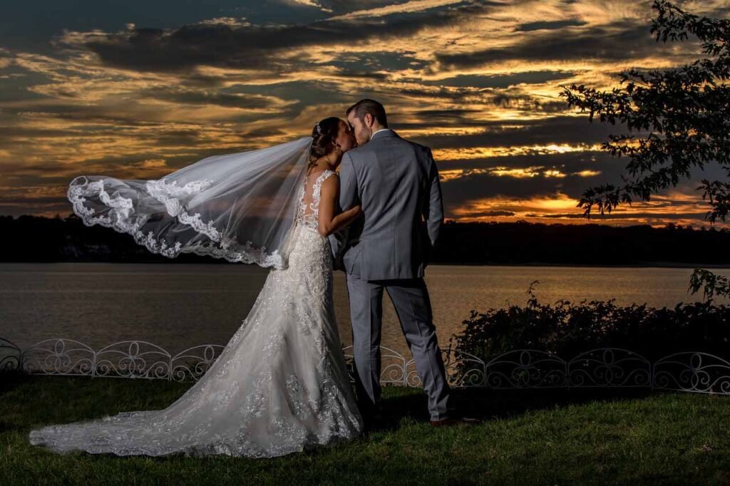 Couple on the lake sunset dramatic
